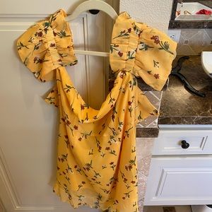 Night Walker yellow off shoulder dress.